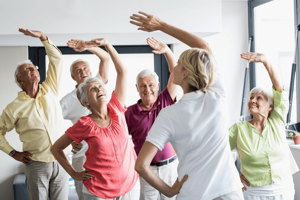 A Senior Person Participating In A Community-Based Exercise Program, Enjoying The Many Benefits Of Exercise