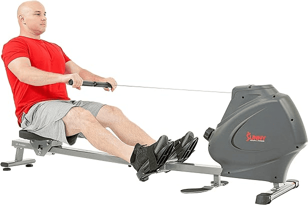 A Person Using A Sunny Health &Amp; Fitness Rowing Machine